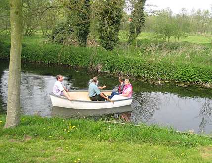 4 persons in a boat
